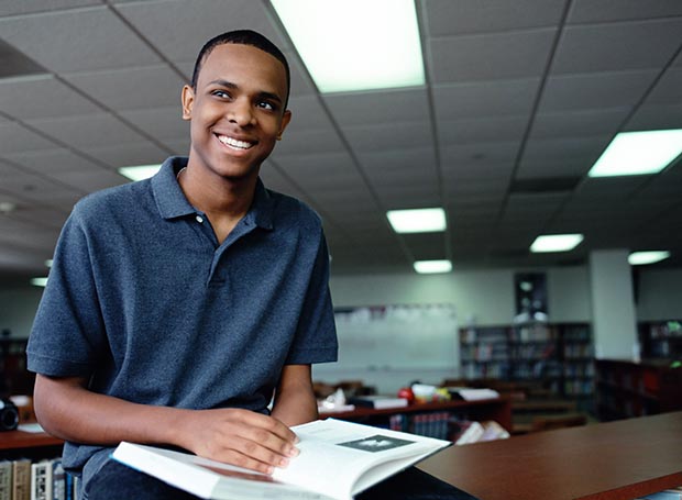 Smiling man in library